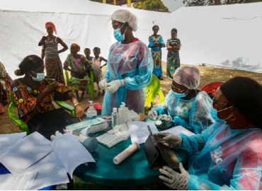 On 26 February 2021 Nurse N'dore Kassie prepares to administer a dose of the rVSV-ZEBOV Ebola vaccine to a woman in the community of Gouéké     This is the first time the disease has been reported in Guinea since the previous outbreak ended in 2016  The Ministry of Health of the Republic of Guinea announced a new outbreak of Ebola virus disease on 14 February 2021 after a cluster of cases was reported in in the sub-prefecture of Gouéké, N Zérékoré Region    WHO is supporting the Government-led response to set up testing, treatment structures, and with medical supplies, vaccines, therapeutics, and diagnostic capacities to quickly contain the outbreak 